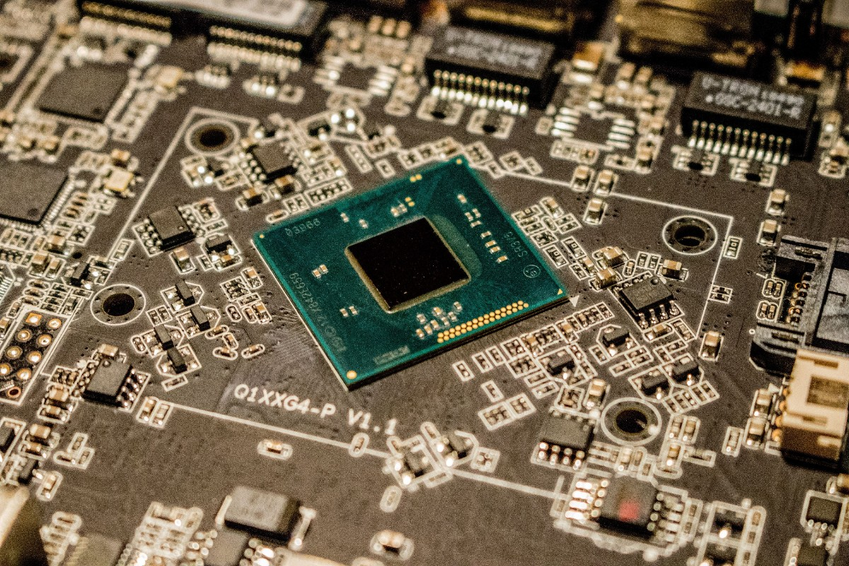 Close-up macro shot of a BIOS chip on a laptop motherboard at Inceptial Systems Nairobi